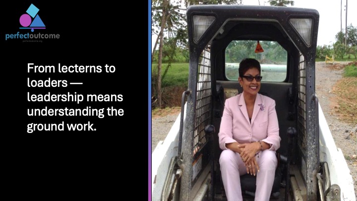 Leader seated in a loader to represent hands-on leadership and understanding ground-level work.