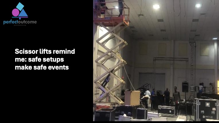 Event setup in progress using a scissor lift to emphasize safe and professional event preparation.